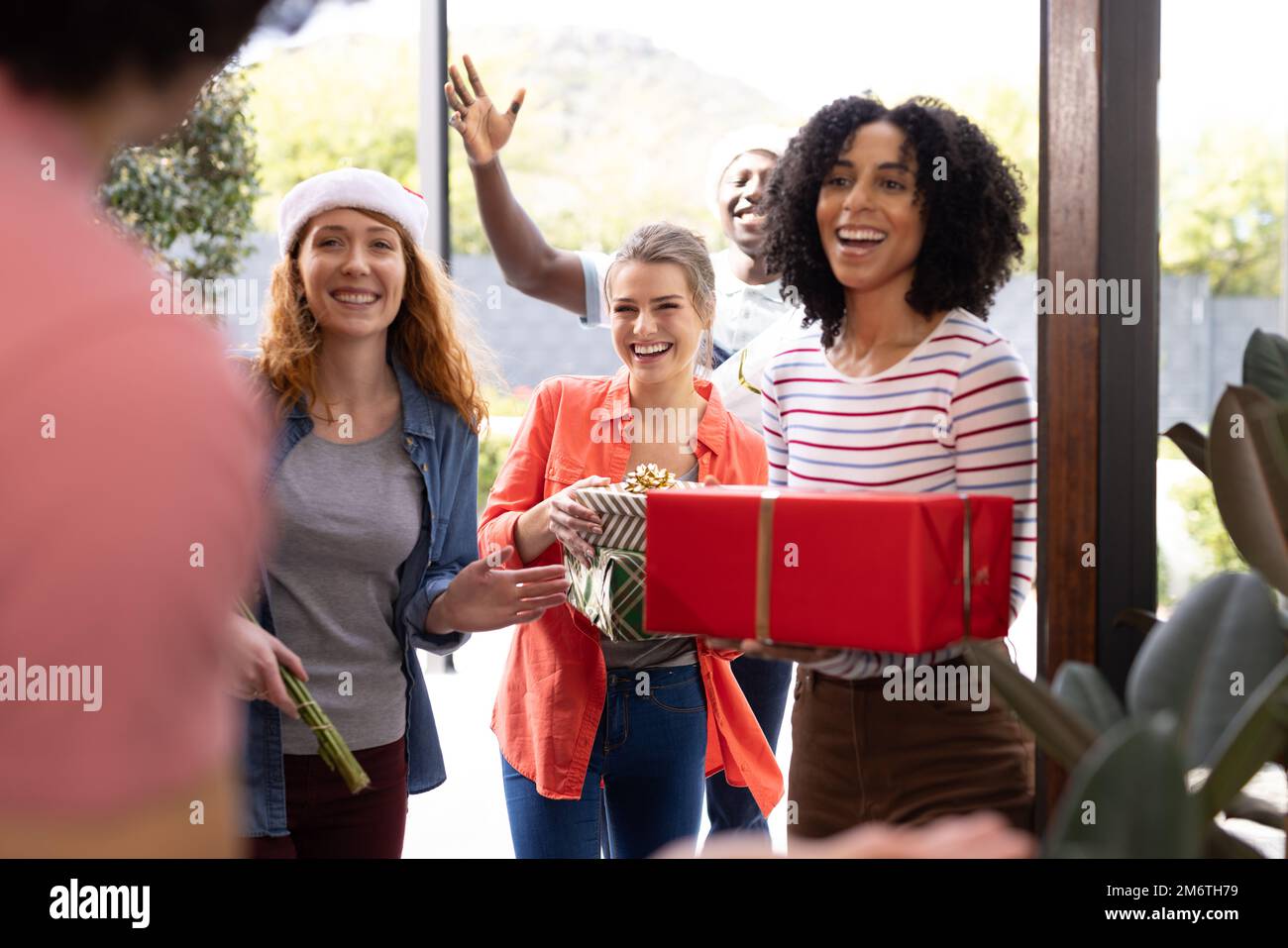 Greeting friends at the door hi-res stock photography and images - Alamy