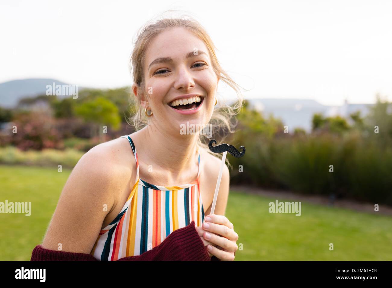 Attractive woman fake moustache hi-res stock photography and images - Alamy