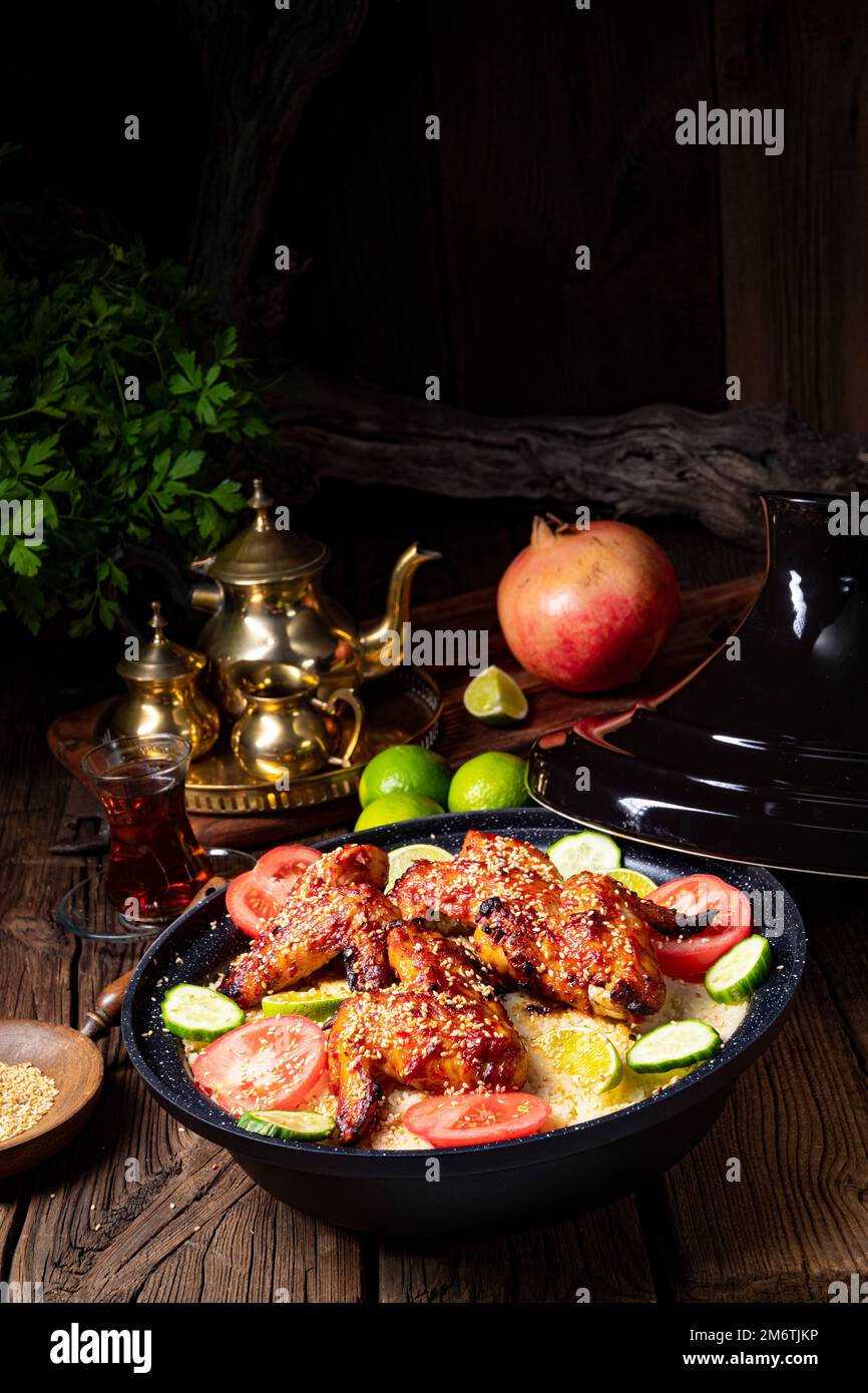 Couscous with fried chicken wings spicy Stock Photo Alamy