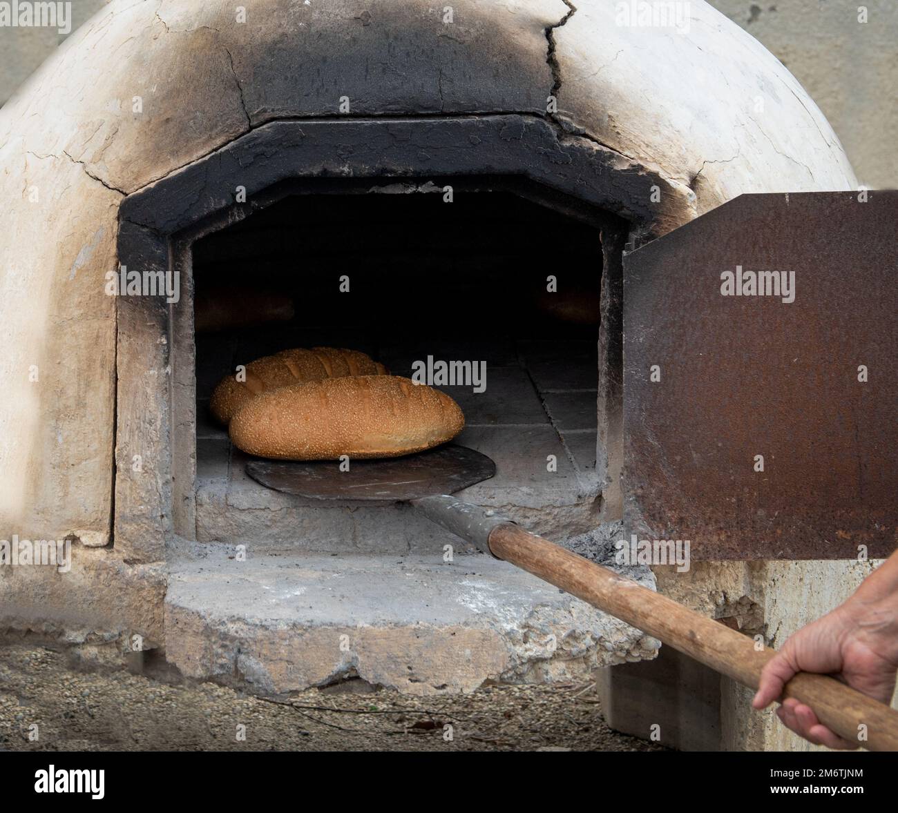 Fresh homemade bread cooked on a traditional clay oven. Home bakery Stock Photo