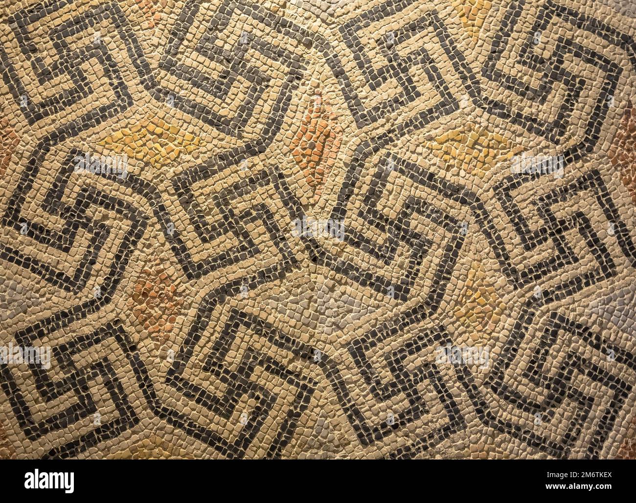 Swastika symbol in ancient Celtic mosaic decoration. Design for an old style background. Stock Photo