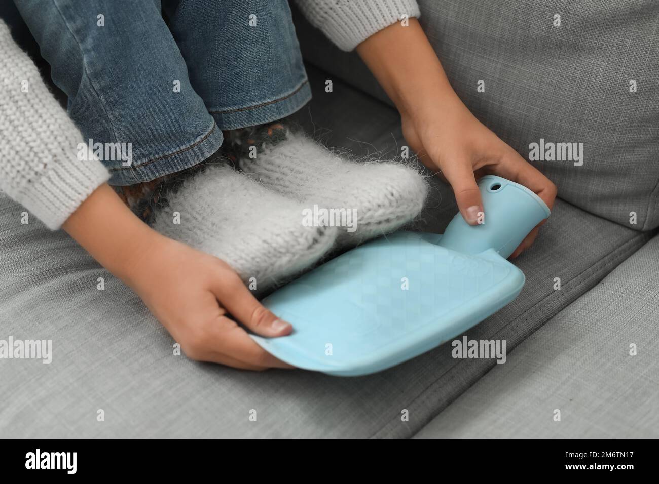 Woman hot water bottle feet hires stock photography and images Alamy