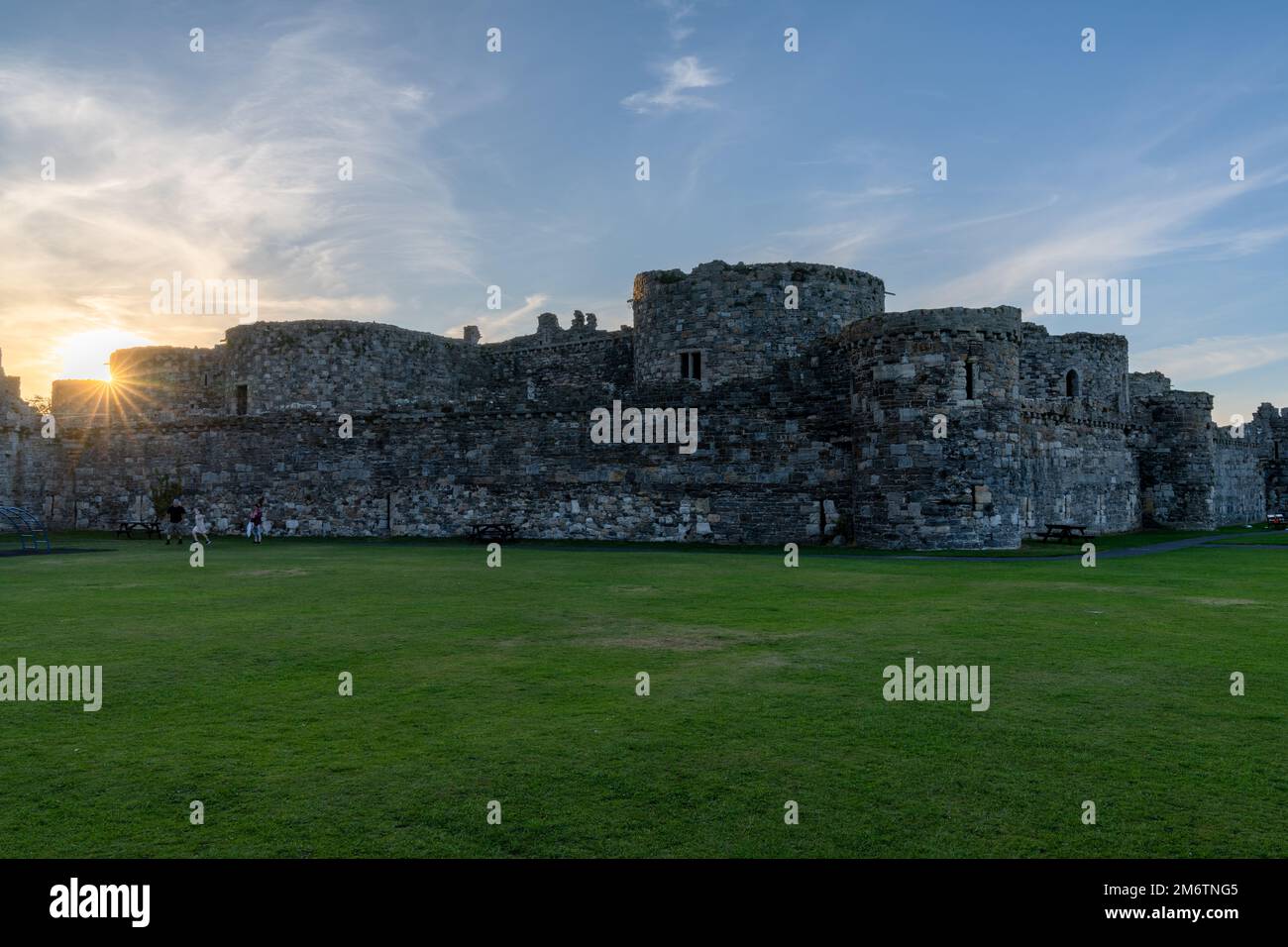 View of the historic Beaumaris Castle in Anglesey at sunset Stock Photo ...