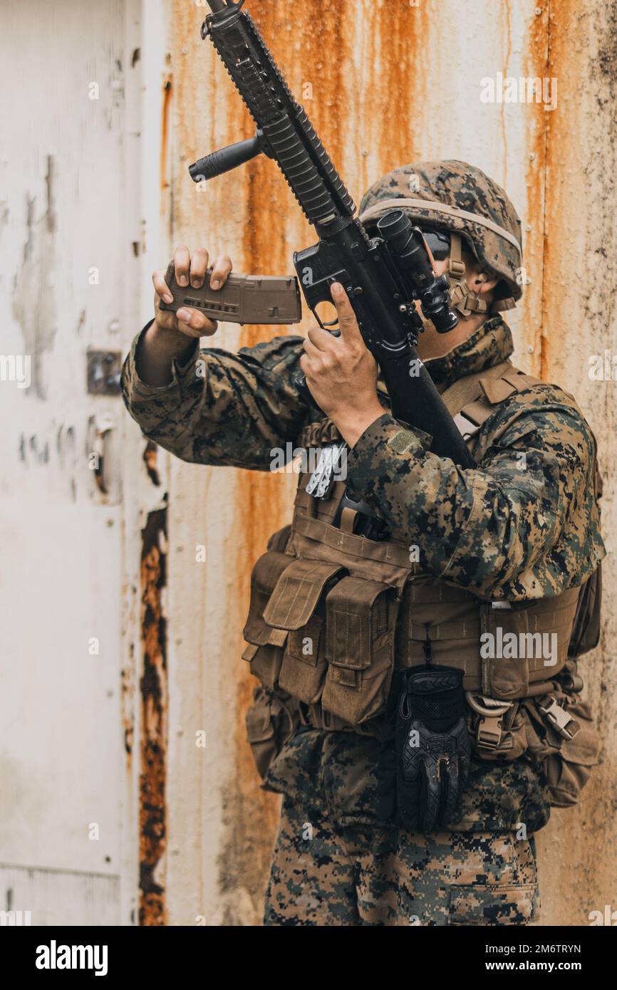 A U.S. Marine with Marine Air Support Squadron MASS 2 reloads an