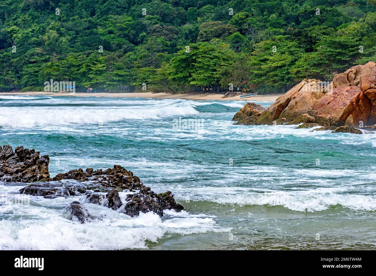 Stunning beach surrounded by rainforest in Trindade Stock Photo