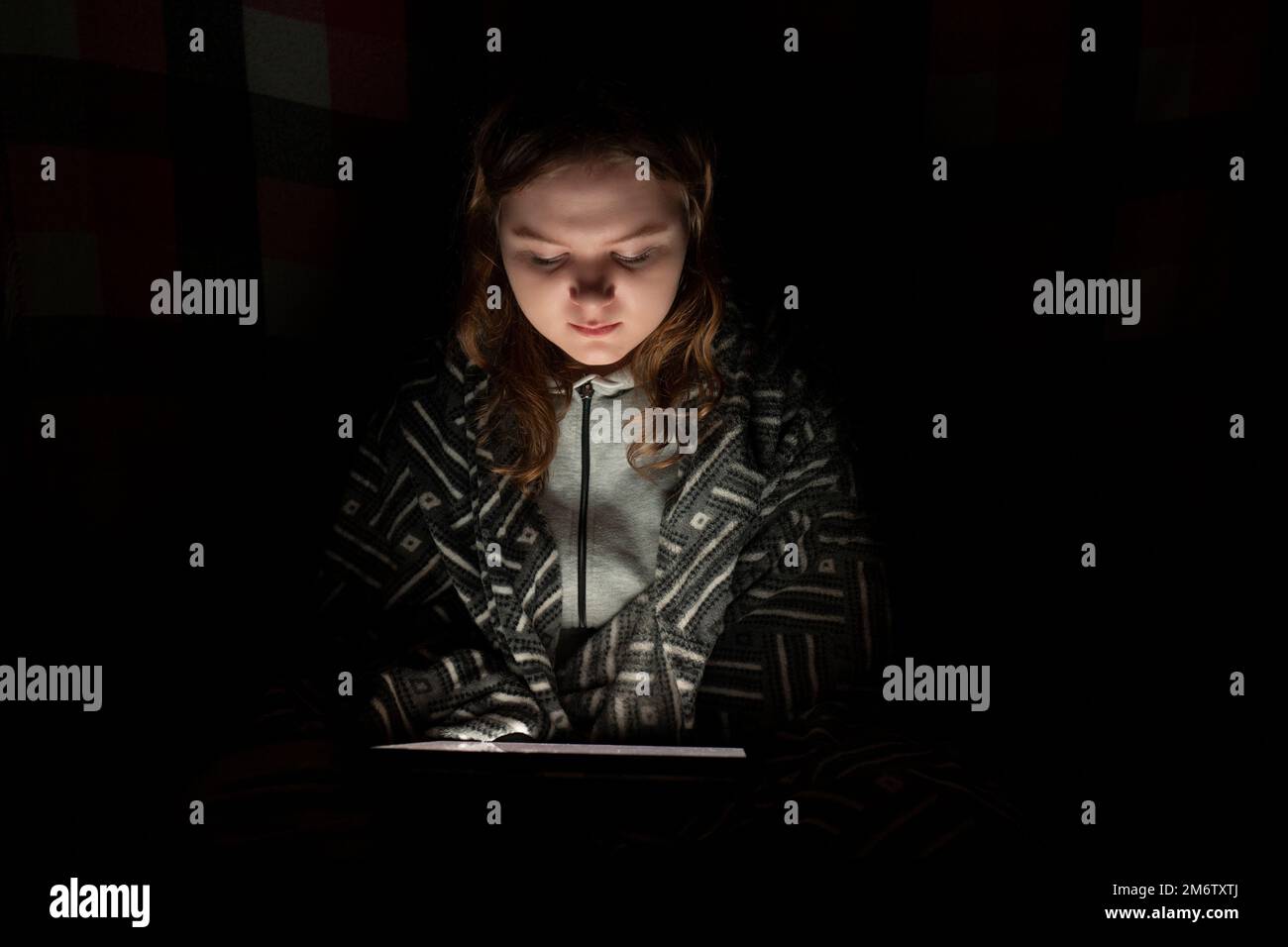 Woman tablet dark room hi-res stock photography and images - Alamy