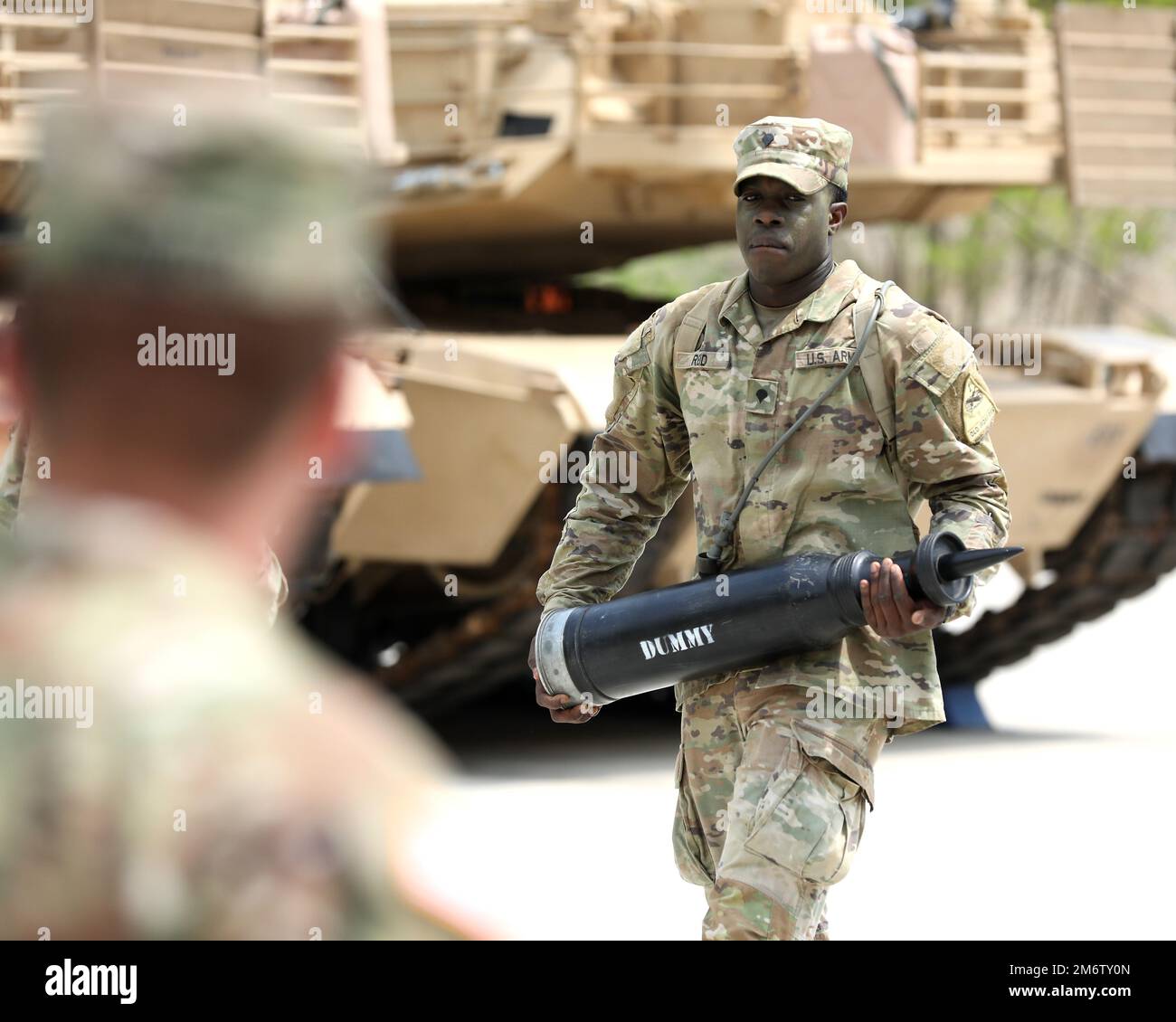 A spurcandidate carries a training round during the spur ride. The 6th
