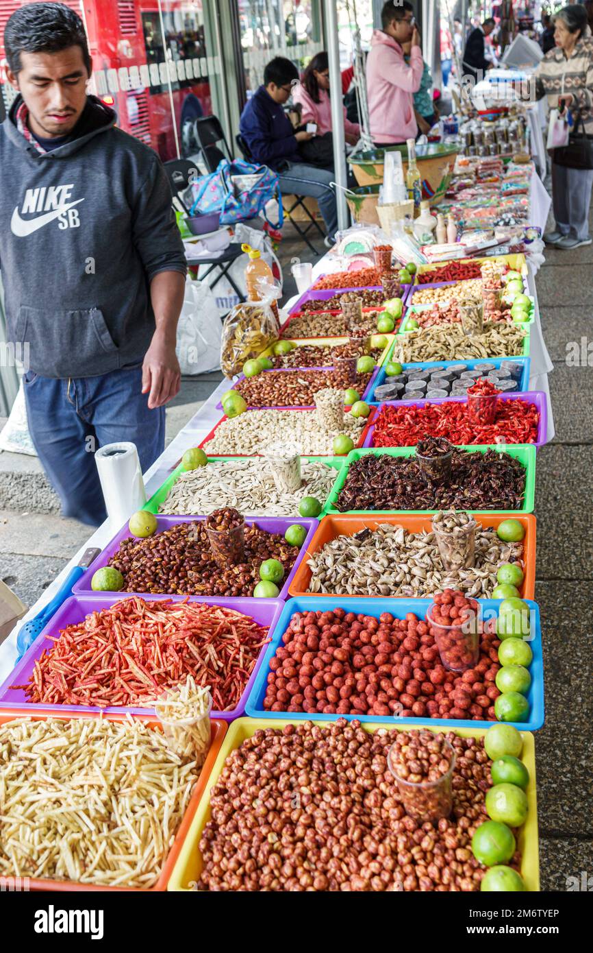 Mexico City,Juarez Cuauhtemoc Avenida Paseo de la Reforma,Christmas holiday artisanal market mercado artesanal,food,nuts,snacks,man men male adult adu Stock Photo