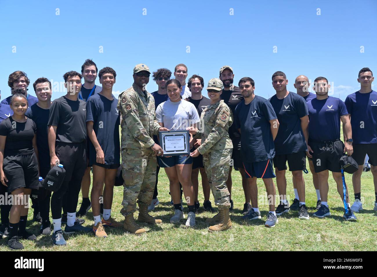 U.S. Air Force Lt. Col. Marcus Stevenson, 333rd Recruiting Squadron commander and Lt. Col. Tiffany Debrow, 342nd Recruiting Squadron commander, present the resiliency flight award to cadets from Air Force Reserve Officer Training Corps Detachment 755 in San Juan, Puerto Rico during Project Blue Helix, May 5, 2022. Project Blue Helix is a week-long event dedicated to highlighting resiliency in Puerto Ricans across the island. Warrior day was a physically taxing event that highlighted resiliency in our force by showcasing some of the actual missions Air Force Special Warfare Airmen have gone thr Stock Photo