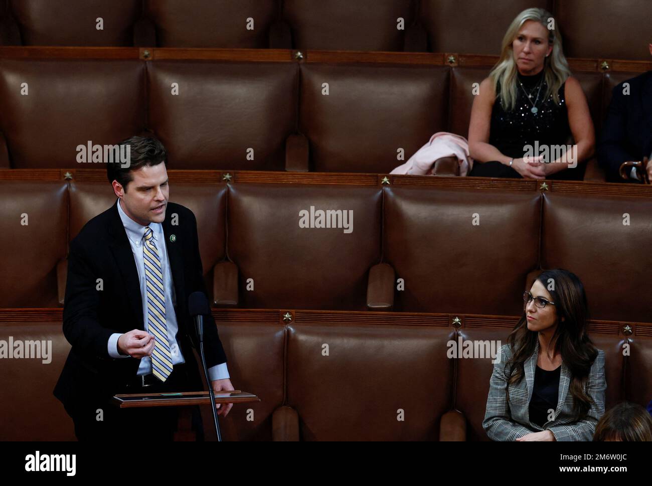 U.S. Rep. Matt Gaetz (R-FL) nominates former President Donald Trump for Speaker of the House as Rep. Marjorie Taylor Greene (R-GA) and Rep. Lauren Boebert (R-CO) watch inside the House Chamber on the third day of the 118th Congress at the U.S. Capitol in Washington, U.S., January 5, 2023. REUTERS/Evelyn Hockstein Stock Photo
