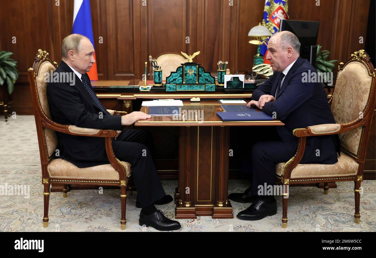 Moscow, Russia. 05th Jan, 2023. Russian President Vladimir Putin holds a face-to-face meeting with the head of the Karachayevo-Circassia ethnic republic, Rashid Temrezov, right, at the Kremlin office, January 5, 2023 in Moscow, Russia. Credit: Mikhail Klimentyev/Kremlin Pool/Alamy Live News Stock Photo