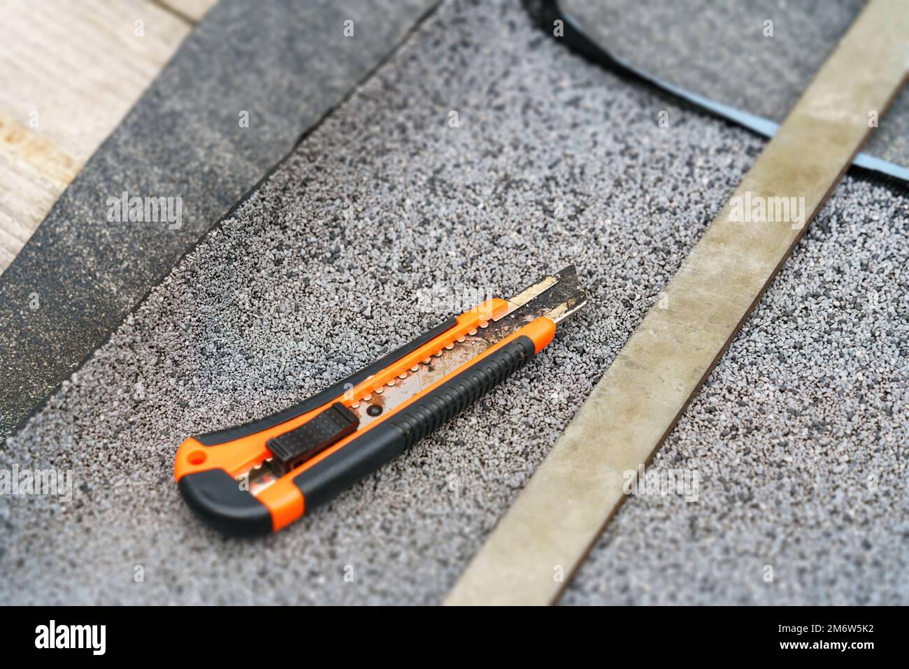 Roofing felt with cutting tool Stock Photo Alamy