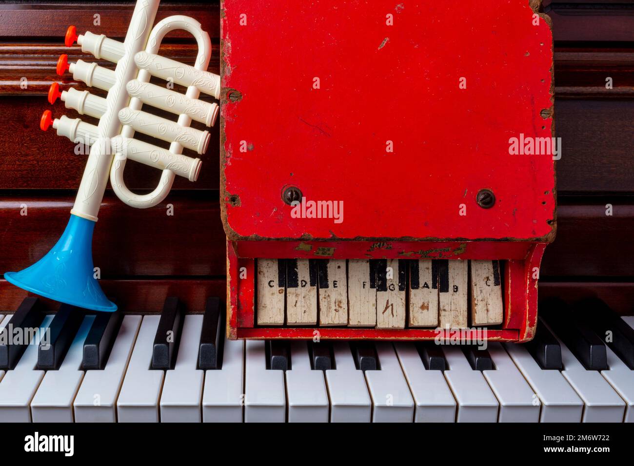 Toy Trumpet And Red Piano Stock Photo