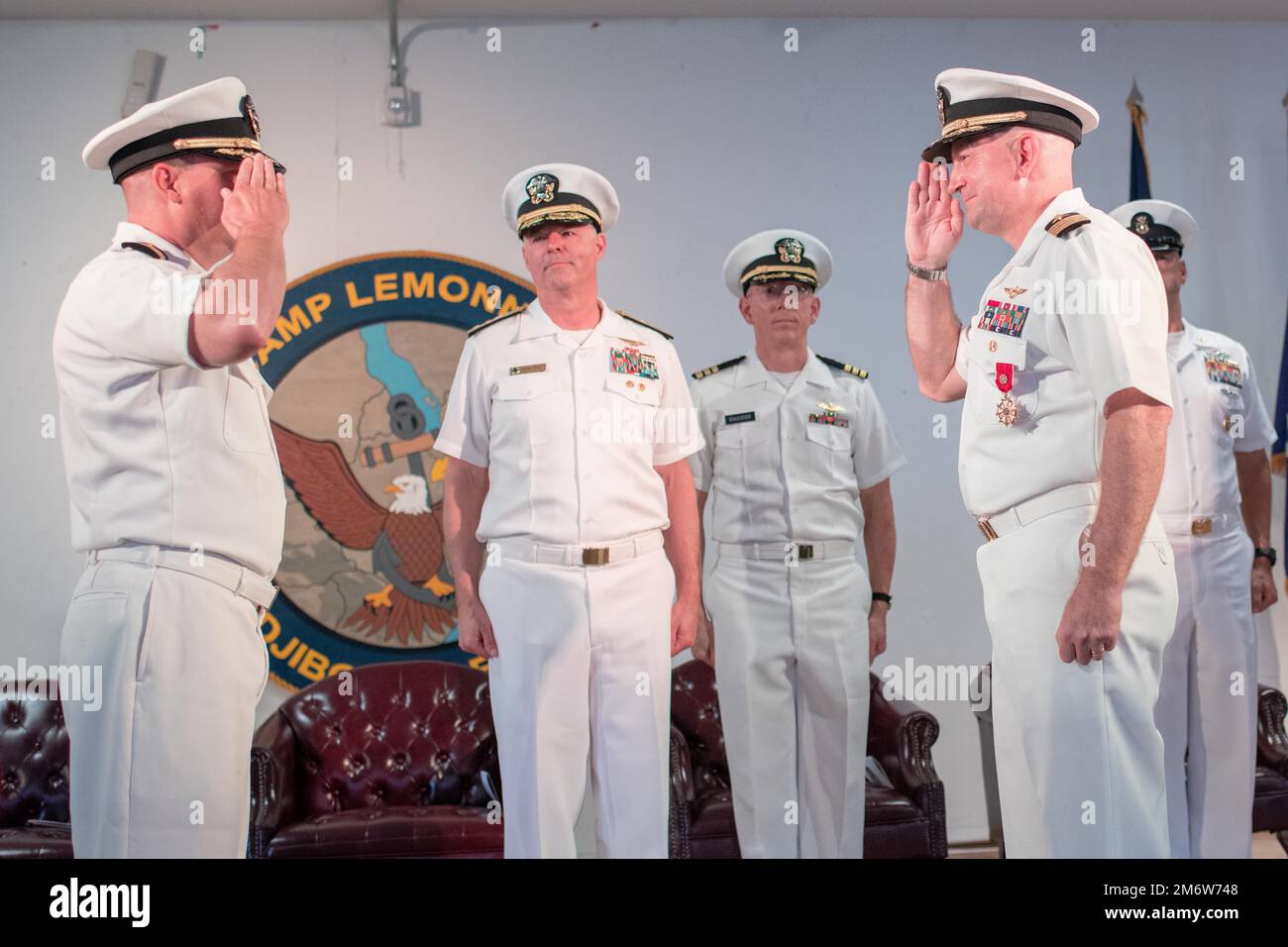 CAMP LEMONNIER, Djibouti (May 6, 2022) U.S. Navy Capt. Brian R. Iber  (left), relieves Capt. David J. Faehnle as the commanding officer of Camp Lemonnier, Djibouti, while Rear Adm. Christopher Gray, commander Navy Region Europe, Africa, Central looks on during a ceremony on camp May 6. Stock Photo