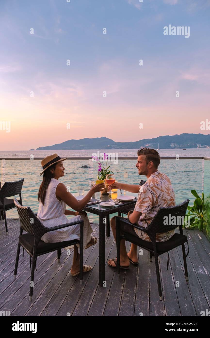 Romantic dinner on the beach with Thai food during sunset on the Island Phuket Thailand Stock Photo