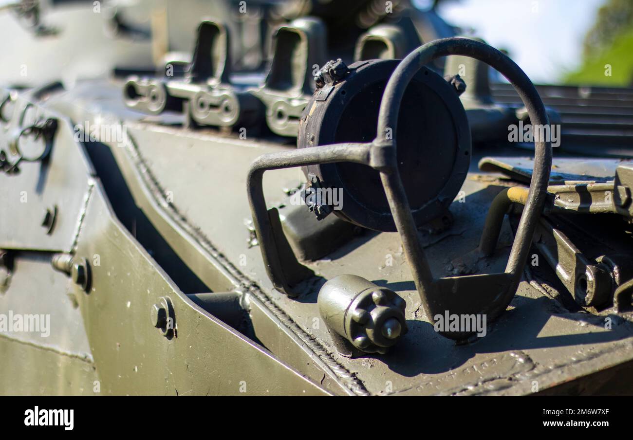 Front headlight with battle tank protection. Very bright searchlight on the tank turret, close-up. Armored infantry fighting veh Stock Photo