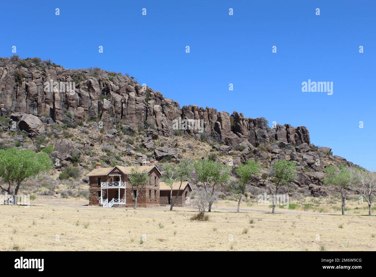 Old building with a mountain behind it at Fort Davis National Historic