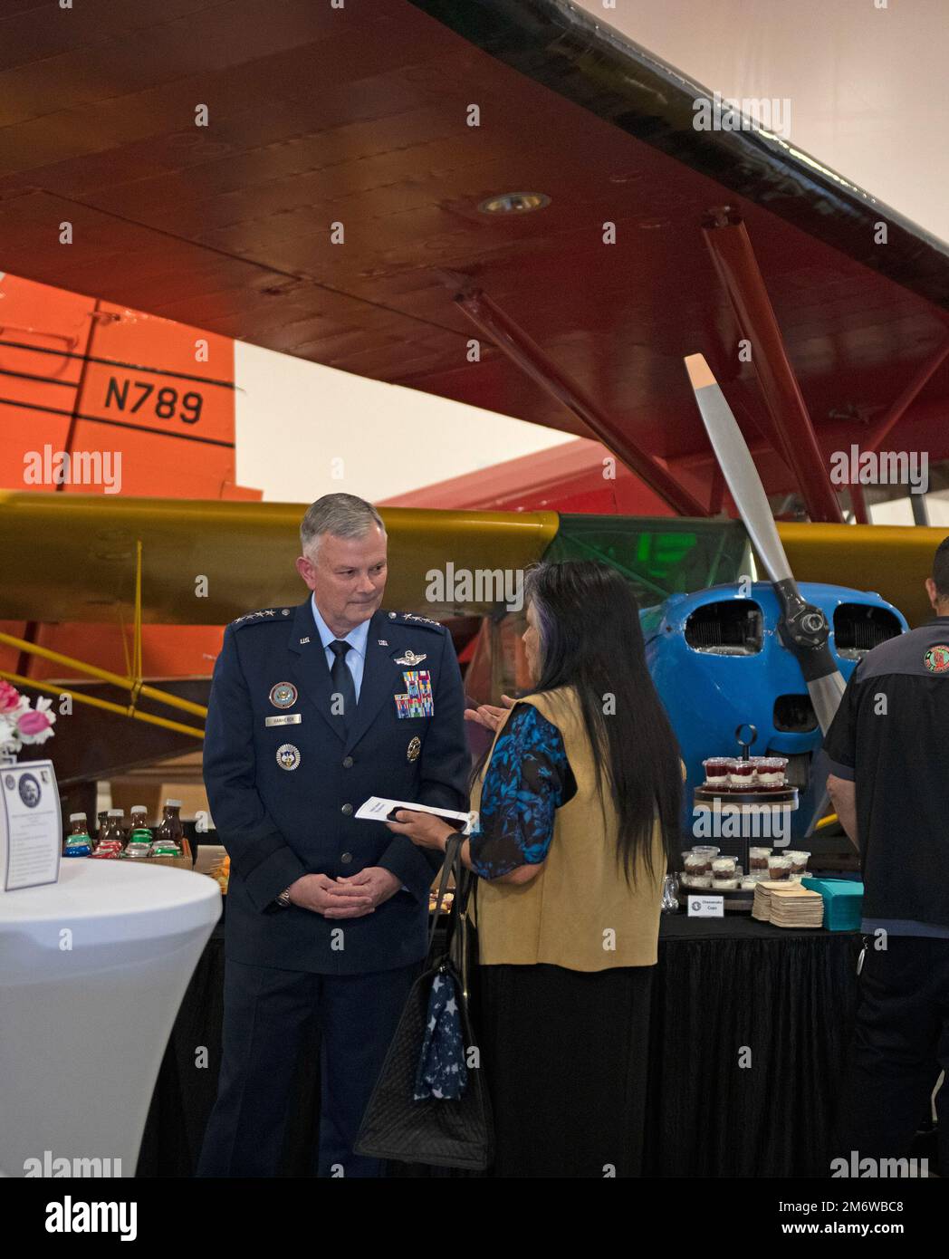 Gen. Glen VanHerck, Commander, North American Aerospace Defense Command and U.S. Northern Command, speaks with Marie Coleman, 2nd Chief, Native Village of Eklutna, Alaska, before providing the keynote address highlighting the 75th Anniversary of Alaskan Command, a USNORTHCOM subordinate unified command, at the Alaska Aviation Museum, Anchorage, Alaska, May 6, 2022. Ms. Coleman was the guest speaker for the event. (Department of Defense photo by Chuck Marsh) Stock Photo