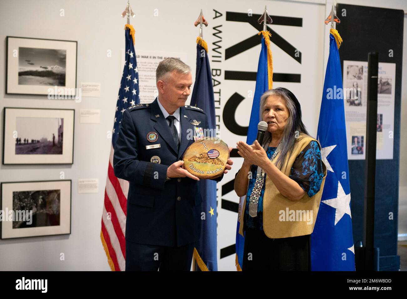 Gen. Glen VanHerck, Commander, North American Aerospace Defense Command and U.S. Northern Command, is presented a gift from Marie Coleman, 2nd Chief, Native Village of Eklutna, Alaska, before providing the keynote address highlighting the 75th Anniversary of Alaskan Command, a USNORTHCOM subordinate unified command, at the Alaska Aviation Museum, Anchorage, Alaska, May 6, 2022. Ms. Coleman was the guest speaker for the event. (Department of Defense photo by Chuck Marsh) Stock Photo