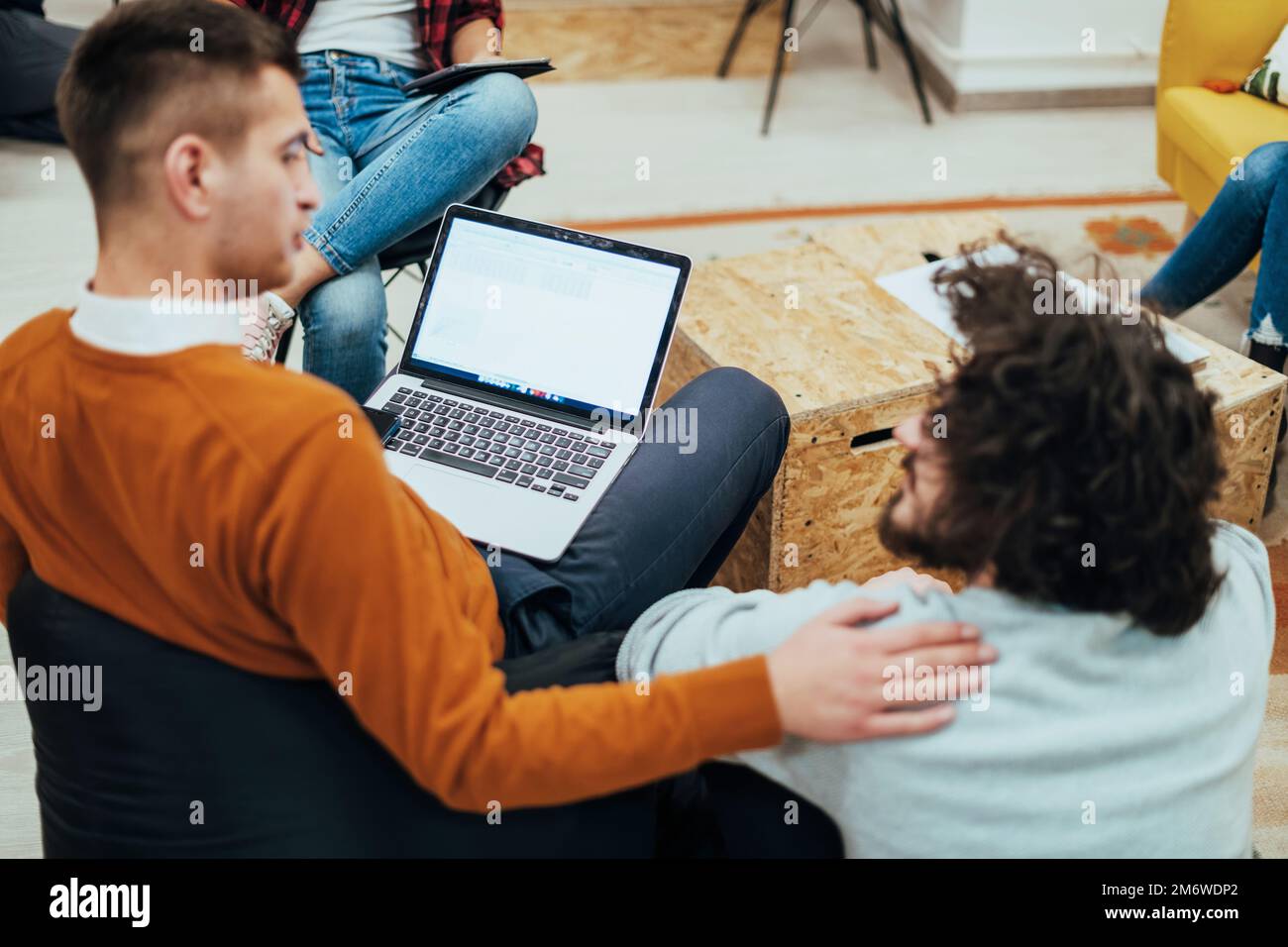 Two men having fun on a break from work in a modern office Stock Photo
