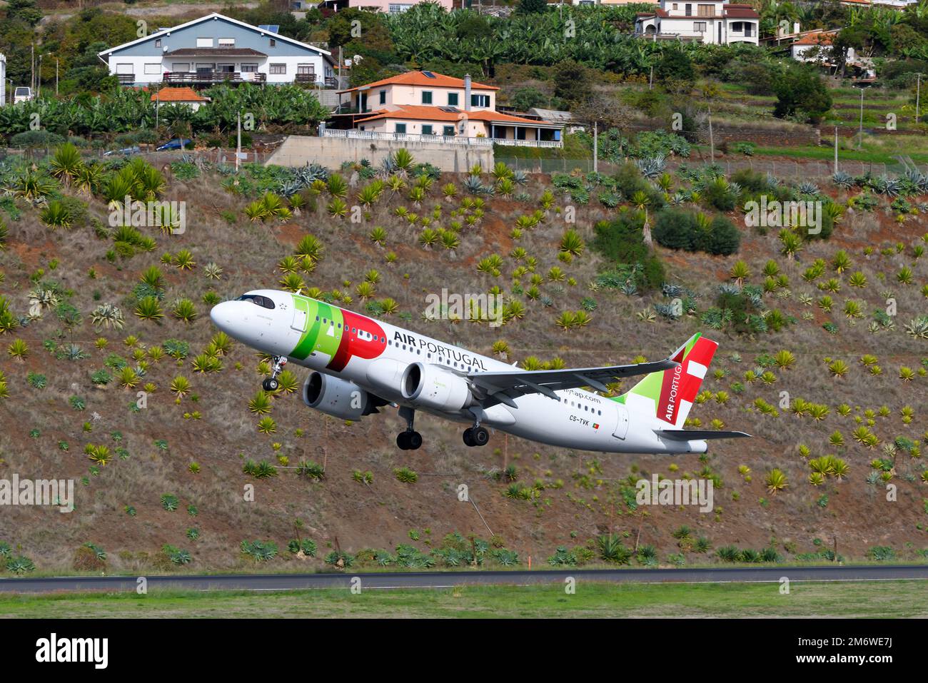 TAP Air Portugal Airbus A320 airplane taking off from Madeira Airport in Funchal Island. Airplane A320 of airline TAP Portugal departing. Stock Photo