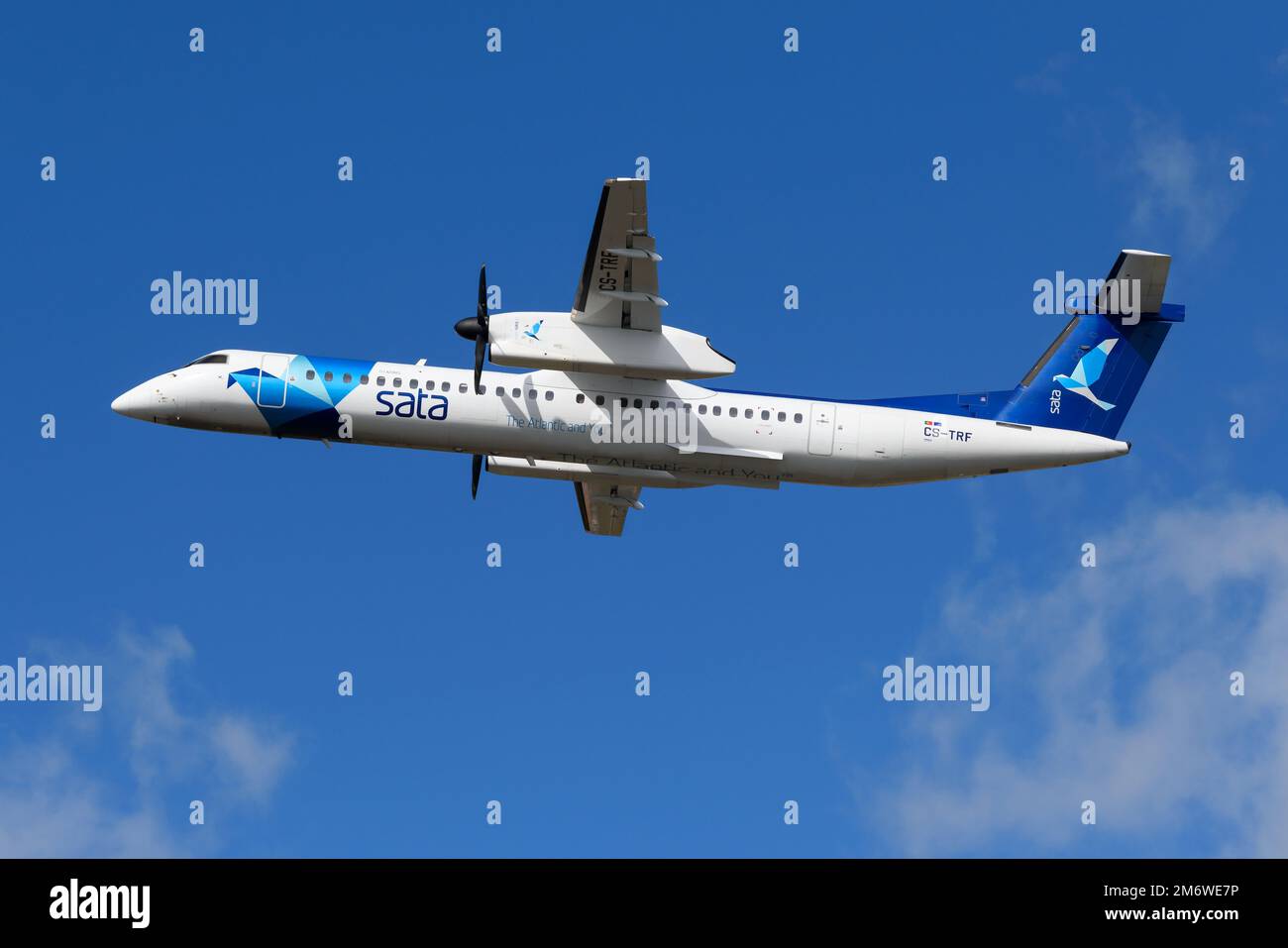 Azores Airlines DHC-8 series aircraft flying. Airplane De Havilland Dash 8 Q400 of Açores Airlines, previously know as SATA Air Acores. Stock Photo