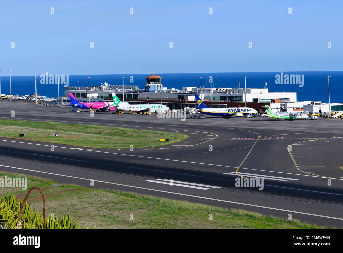 Funchal Airport overview busy with flights. Madeira Airport, also know as Cristiano Ronaldo International Airport, terminal view. Stock Photo