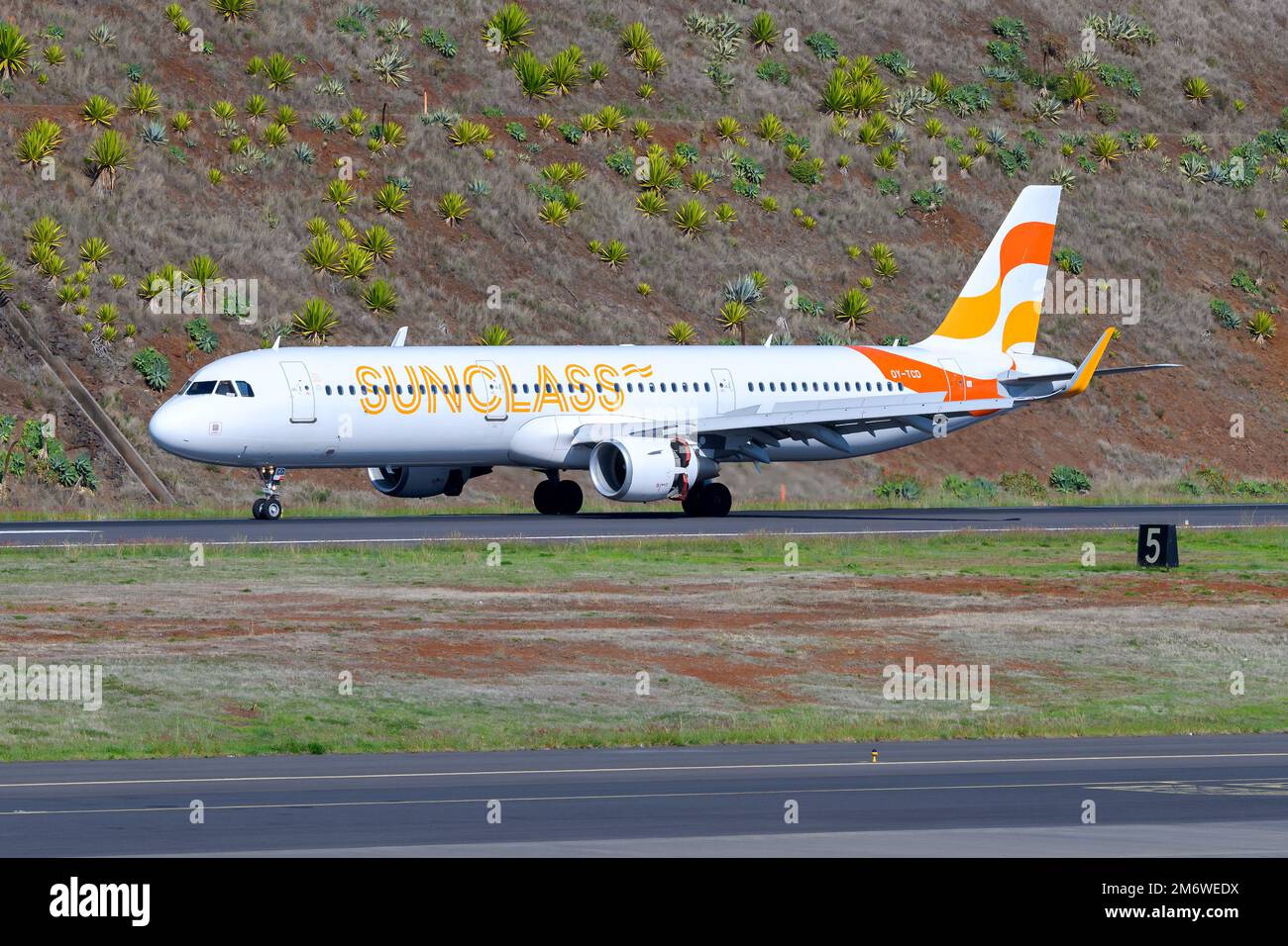 Sunclass Airlines A321 aircraft landing at a holiday destination. Charter SunClass Airline with Airbus A321 airplane. Stock Photo