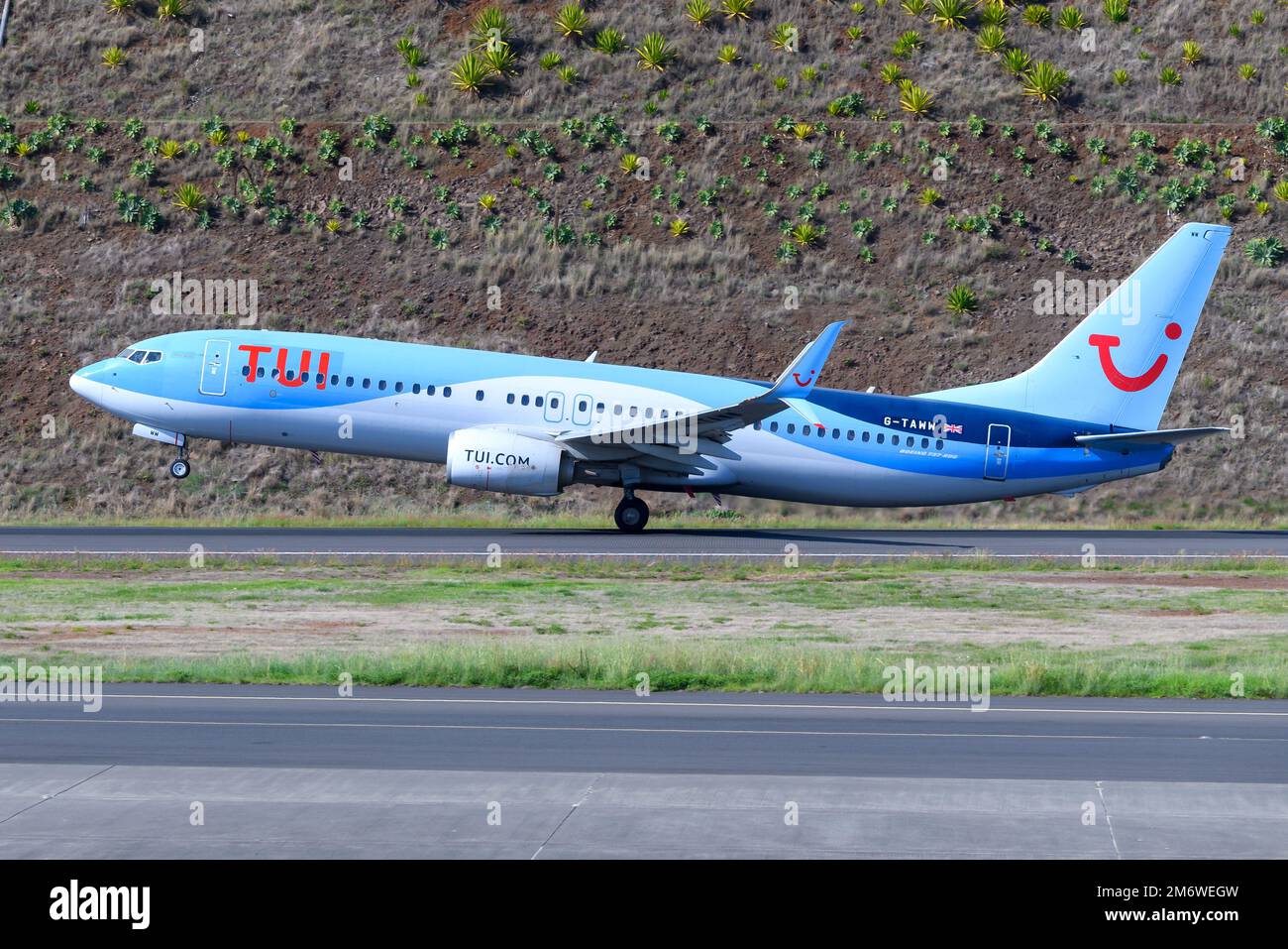 TUI UK Boeing 737 aircraft taking off. Airplane 737-800 of Tui UK departing. Stock Photo