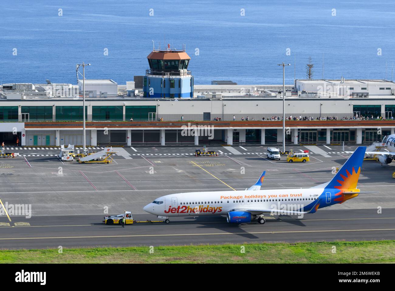 Funchal Airport passengers terminal exterior view. Madeira Airport air traffic control tower (Atc tower) and open air observation deck. Stock Photo
