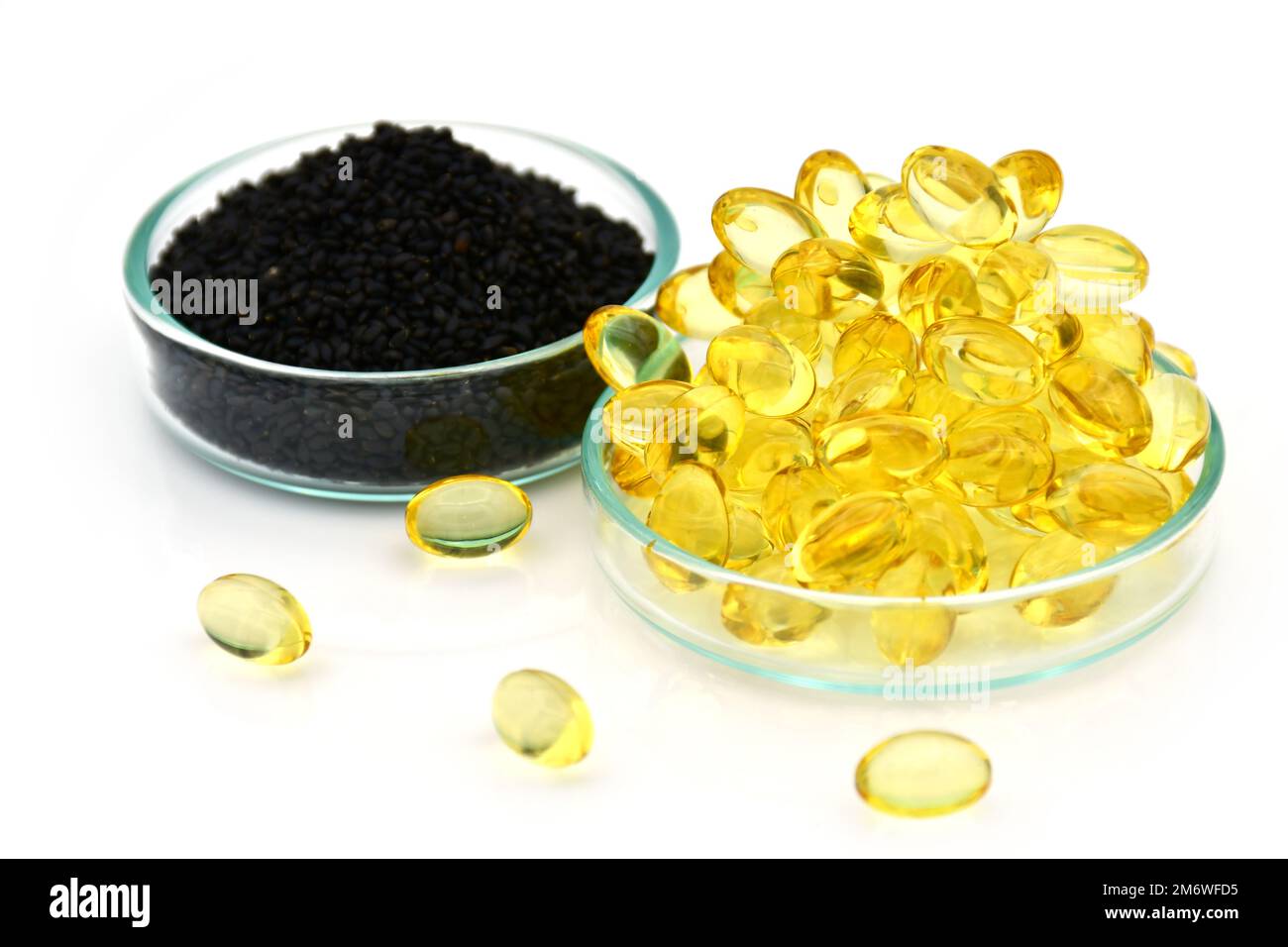 Black sesame with sesame oil capsule, Dietary supplement for balamce of health and mental health. Stock Photo