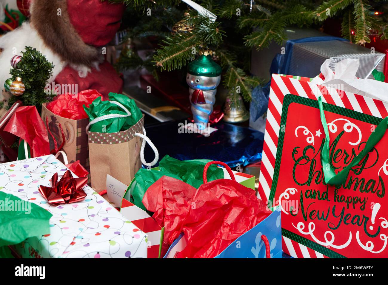 Presents set around the christmas tree Stock Photo Alamy