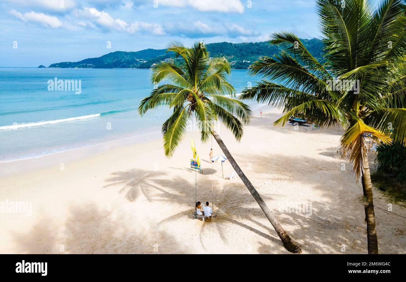 Bang Tao Beach during sunset in Phuket Thailand, palm trees during ...