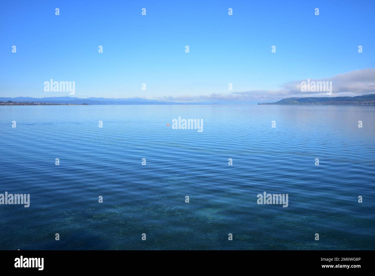 Calm and cold winter day on Lake Taupo. Location: Taupo New Zealand Stock Photo