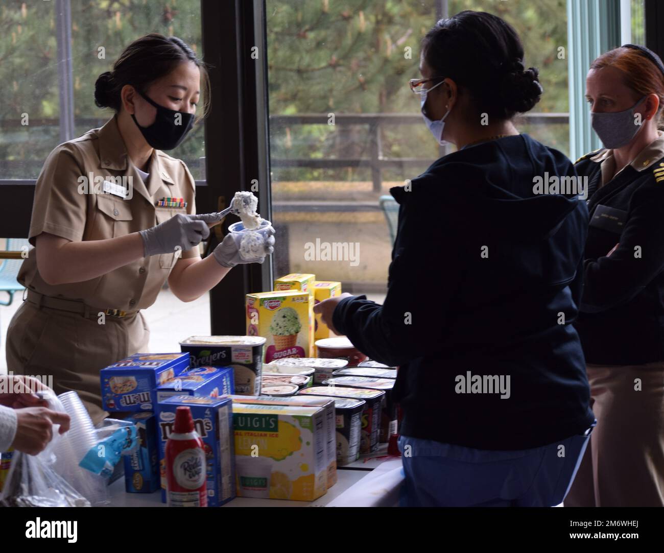 Here’s the scoop…it’s National Nurses Week, May 6-12, 2022! Navy Nurse Corps officers, civil service and contractor nurses at Naval Hospital Bremerton provided an ice cream social as part of their heartfelt thanks to all nurses assigned to the command – as well as those they work with and for – in conjunction with the annual celebration, culminating with the Nurse Corps 114th birthday on May 13, a day after the birthday of Florence Nightingale (1820-1910), the founder of modern nursing (Official Navy photo by Douglas H Stutz, NHB/NMRTC Bremerton public affairs officer). Stock Photo