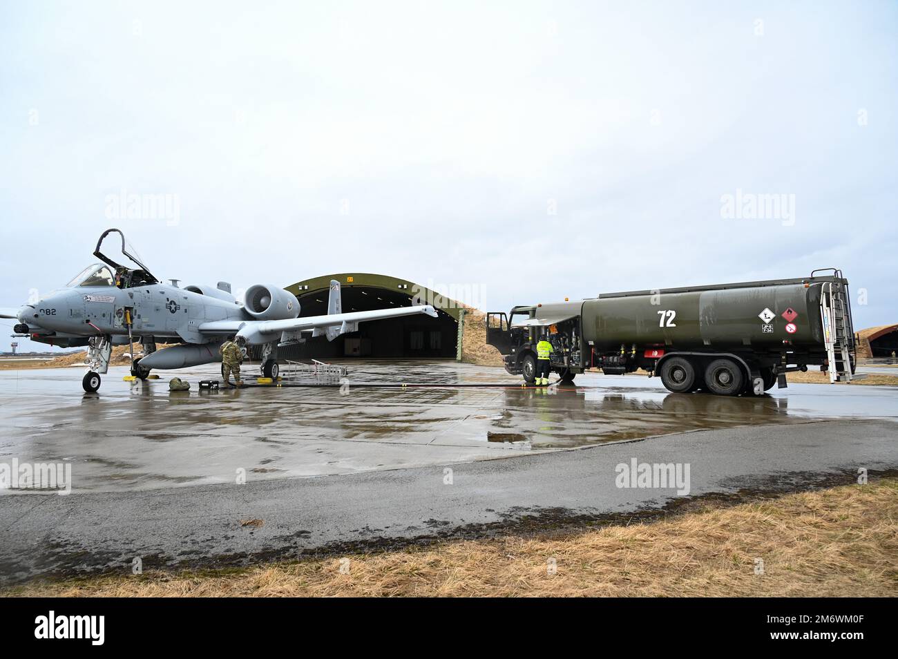 A Norwegian Aviation Fuel Specialist (left) and U.S. Air Force Staff