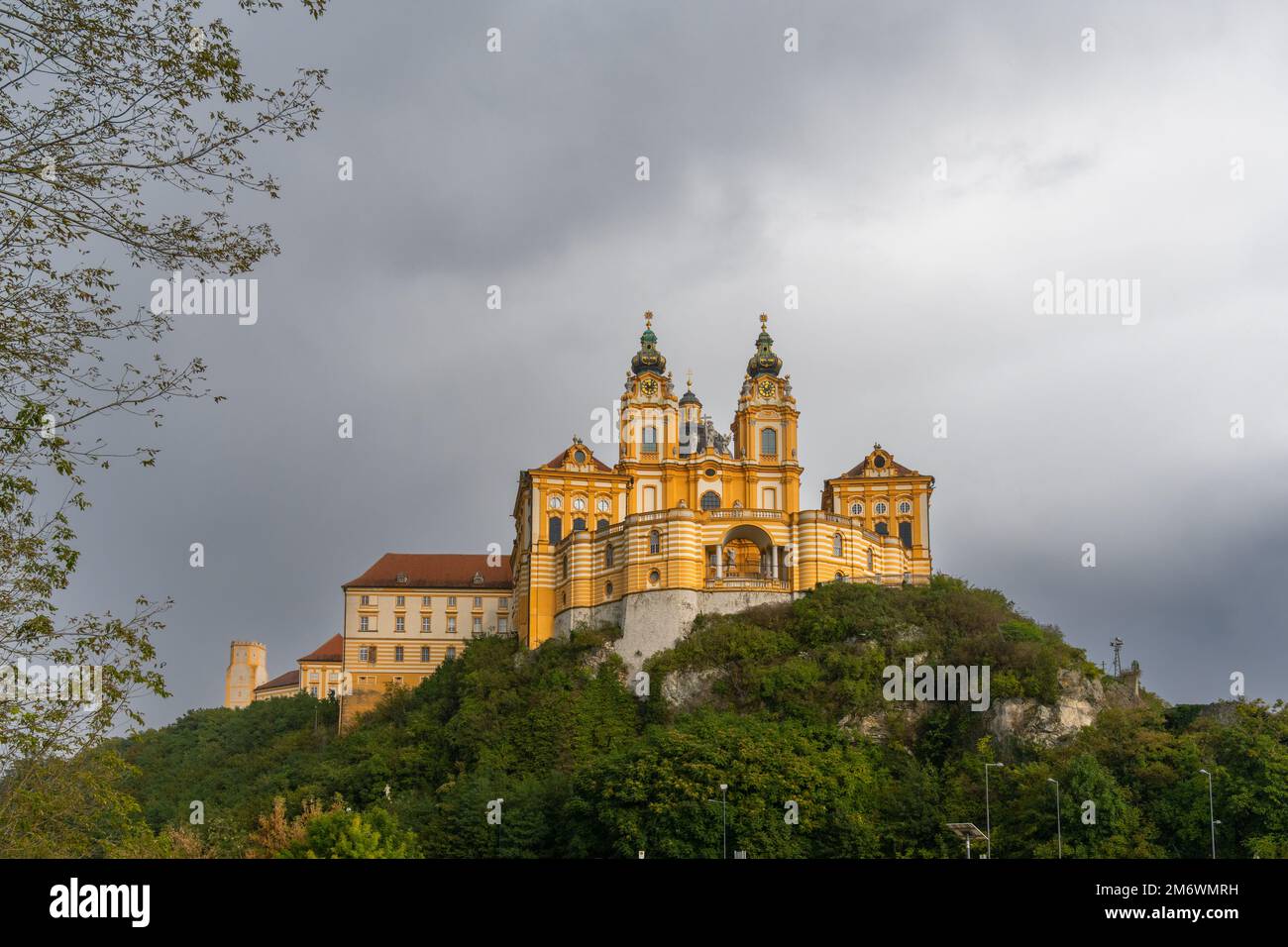 The historic Melk Abbey and church spires on the rocky promontory above the Danube River Stock Photo