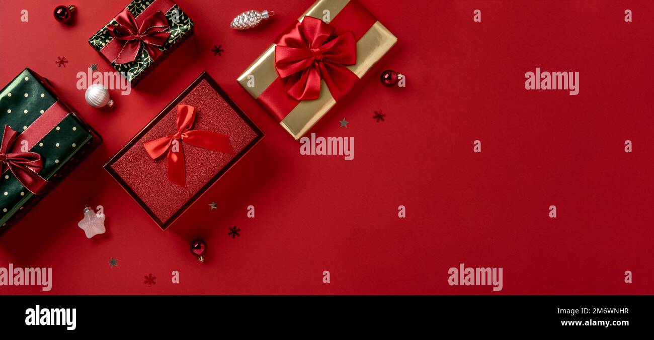 Gift boxes with red ribbon bows on white background Stock Photo - Alamy