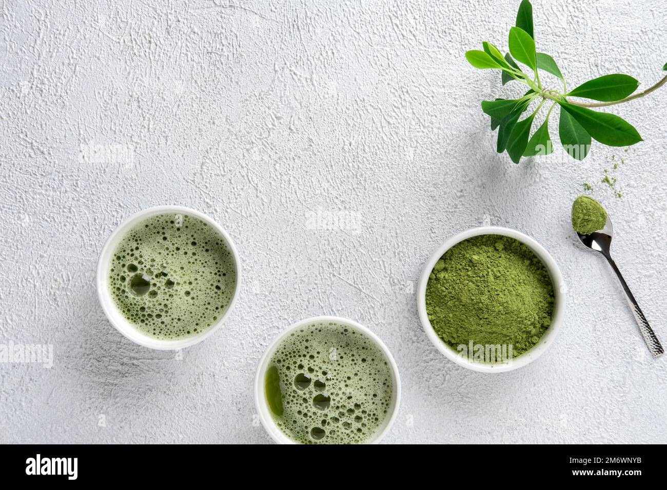 Matcha tea powder on gray concrete background. Tea ceremony. Healthy drink. Traditional japanese drink. Stock Photo