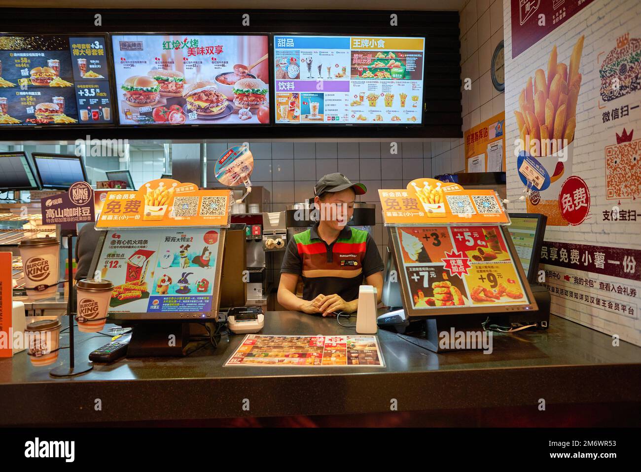 SHENZHEN, CHINA - CIRCA NOVEMBER, 2019: employee at Burger King at KK Mall in Shenzhen. Burger King is a multinational chain of hamburger fast food re Stock Photo