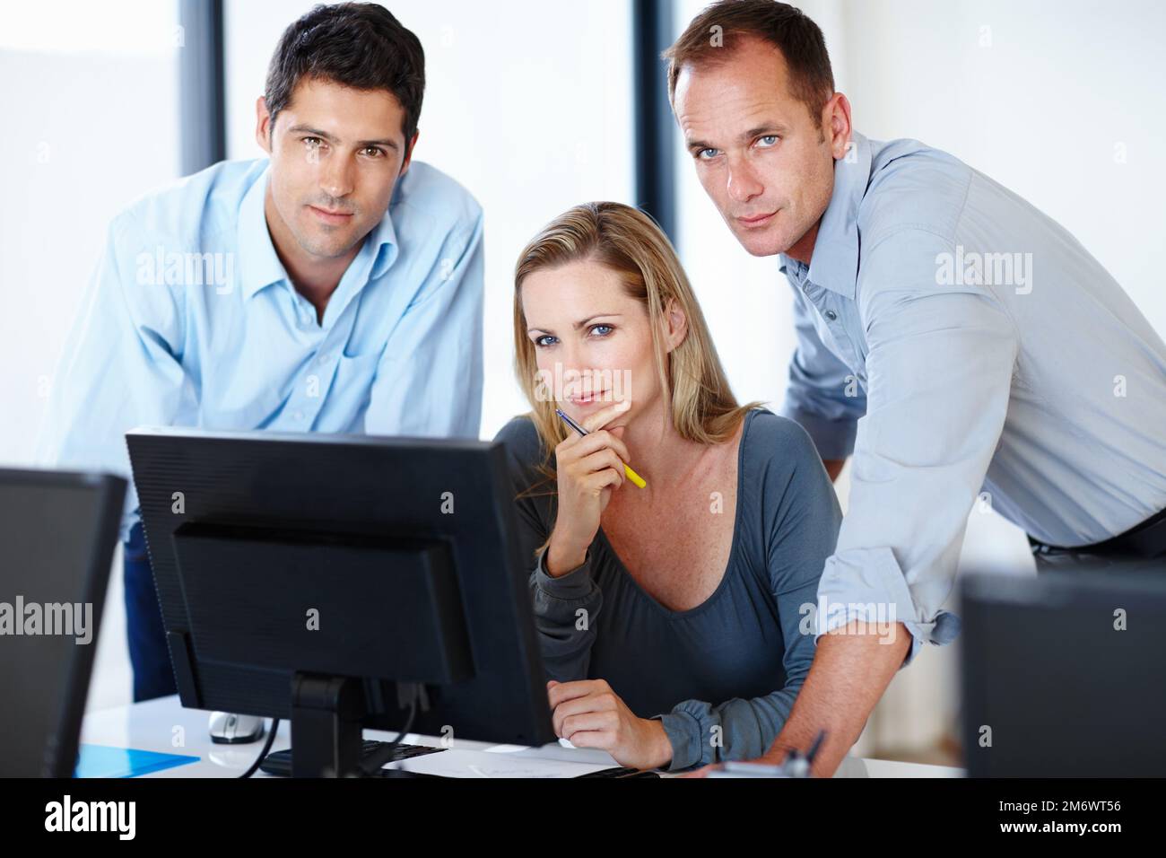 Showing them whos boss. a group of workers looking serious in their office. Stock Photo