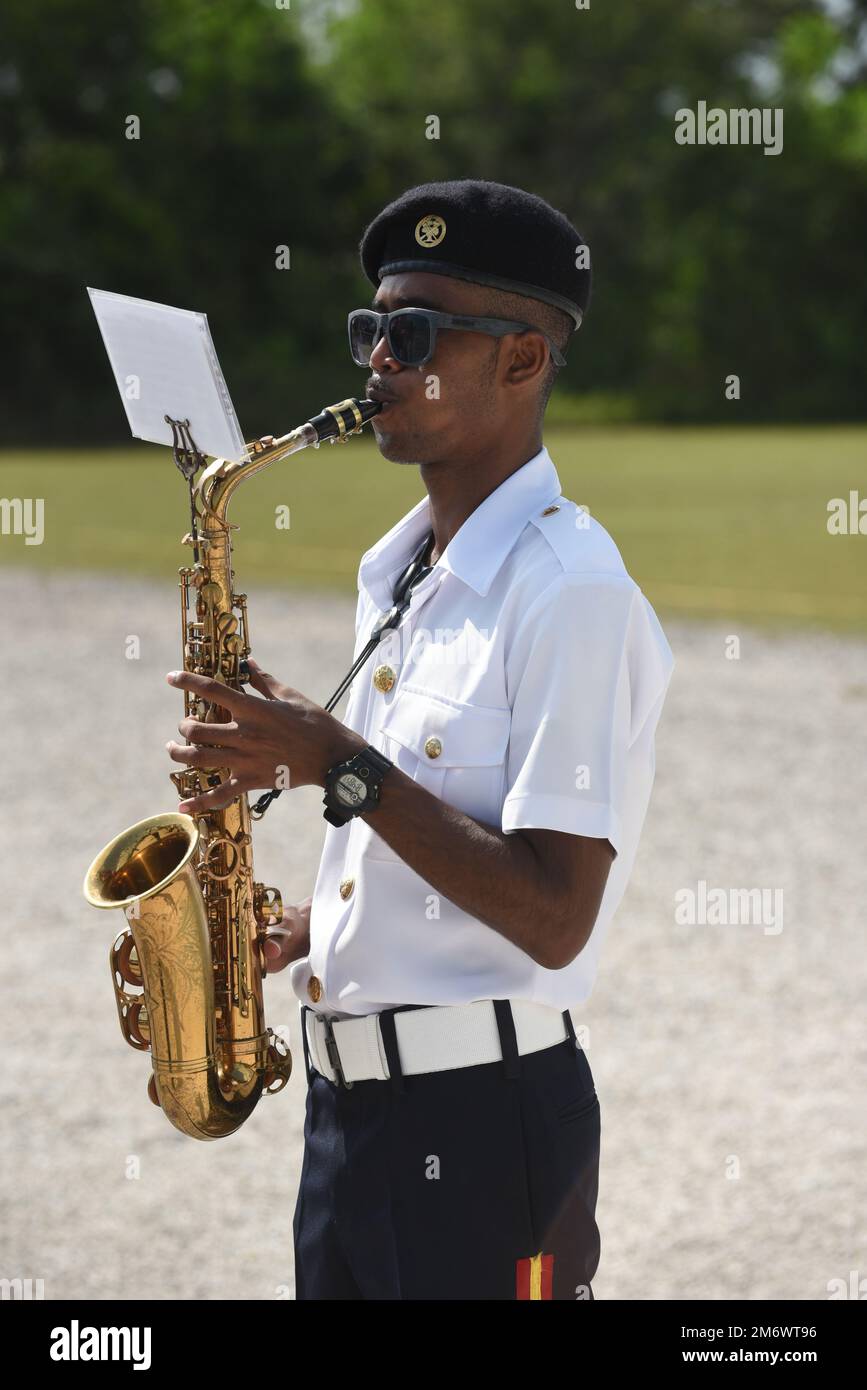A Belize Defence Force Band member plays his saxophone during the