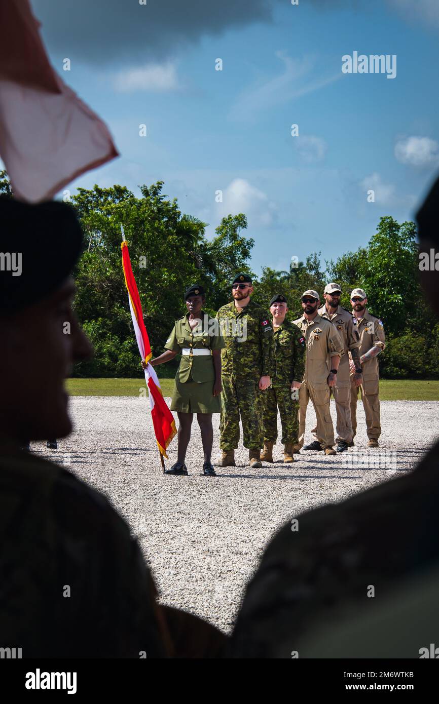 Sailor 1st Class Lucas Kozuch, Sailor 1st Class Brooks Robinson, Sailor First Class Barry Bremner, Master Warrant Officer Nicole Vanalstyne, Captain Aaron Leblanc (right to left), stand on parade during Exercise TRADEWINDS opening ceremony in Belize City, Belize on May 7, 2022.                           Photo: Cpl Alevtina Ostanin - Visual Communications Support (VCS) Stock Photo