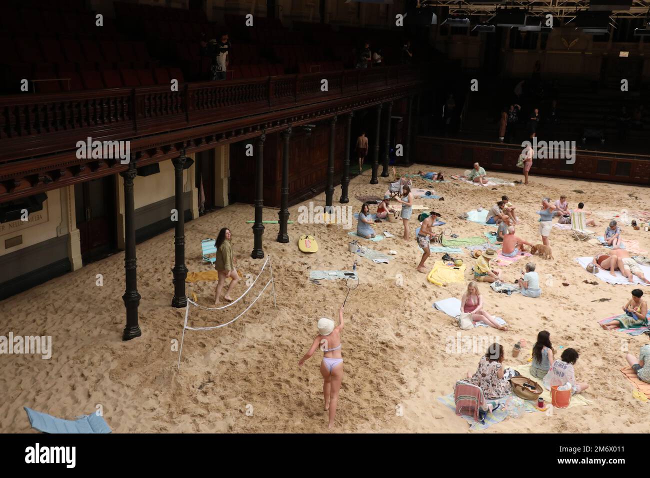 Sydney, Australia. 6th January 2023. Making its Australian premiere on Friday 6 January, the award-winning Sun & Sea will be staged in Sydney Town Hall and transformed to become a beachscape, complete with sand, sunbathers and holidaymakers. A sellout at the 2019 Venice Biennale where it was awarded the Golden Lion, Sun & Sea is a durational English-language opera work in-the-round that confronts themes of climate emergency with humour and power. Credit: Richard Milnes/Alamy Live News Stock Photo