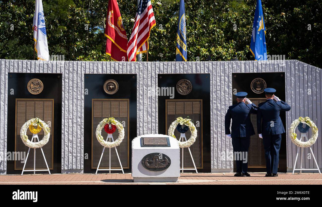 Chief Master Sgt. Jeremy Phillips and Lt. Col. Jeff Ledoux salute the