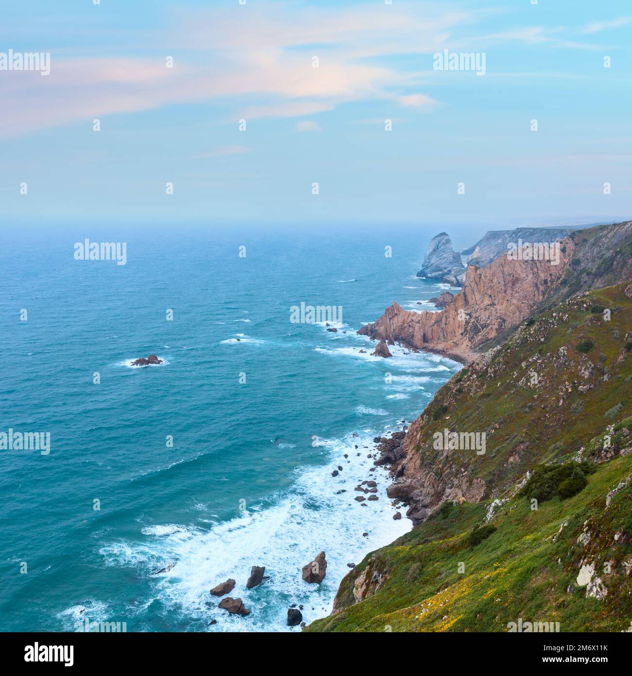 Atlantic ocean coast (granite boulders and sea cliffs) in cloudy ...