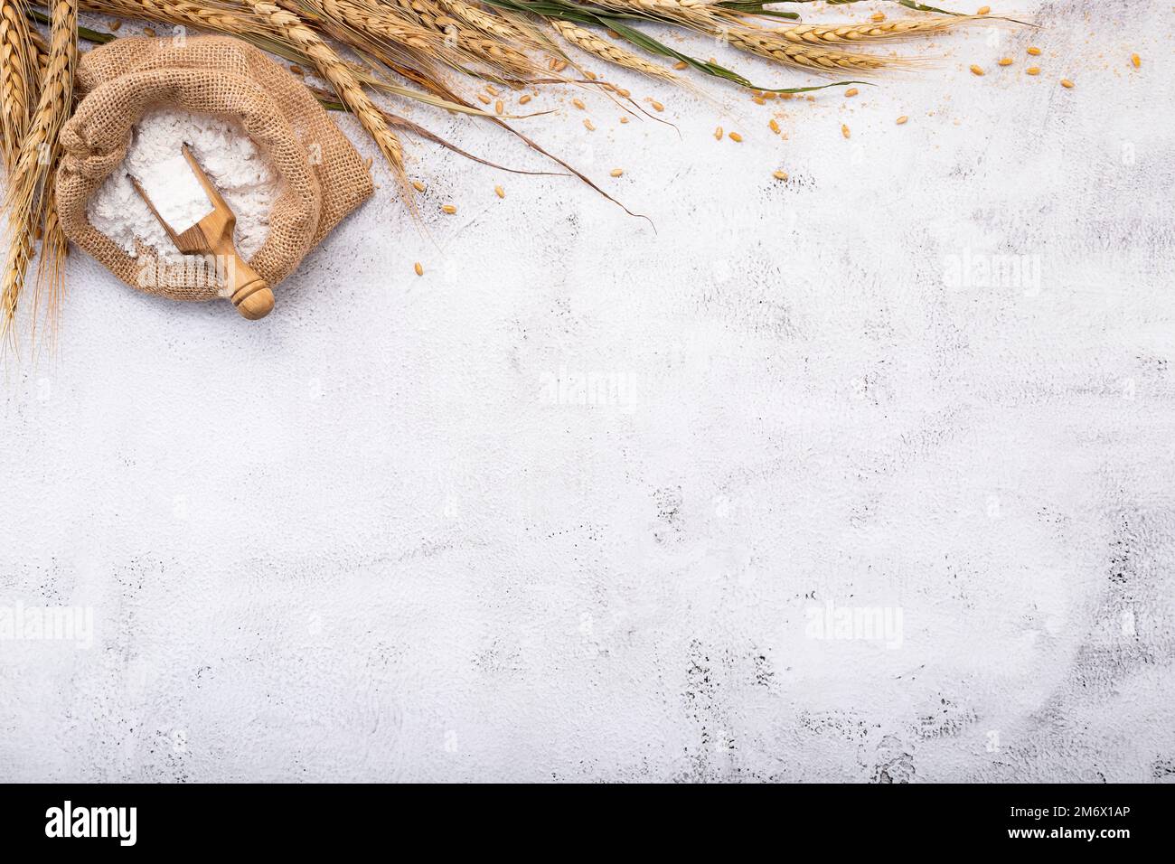Wheat ears and wheat grains set up on white stone background Stock ...