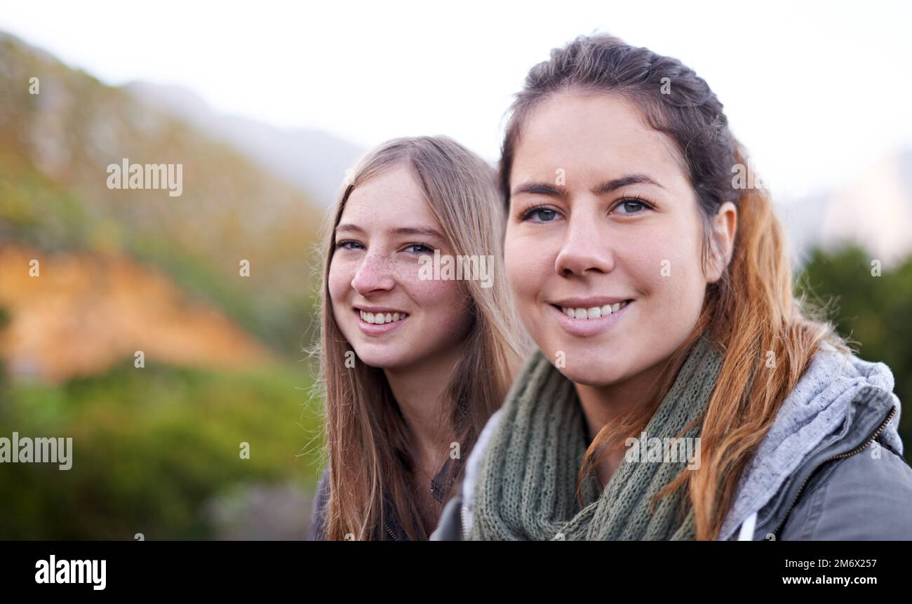Hiking with a friend. Portrait of two attractive young female hikers in ...
