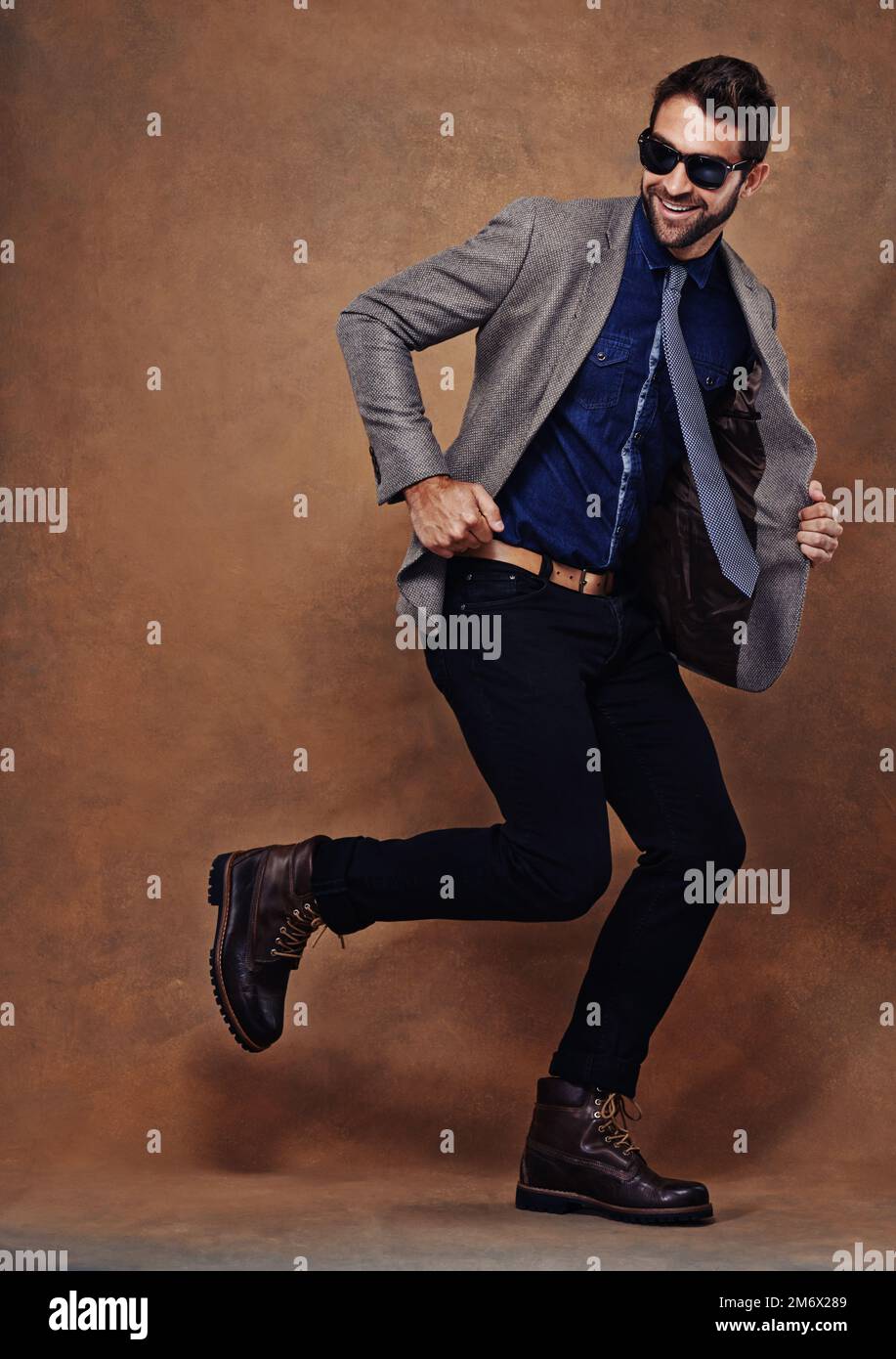 Hes a mover and shaker of mens style. Studio shot of a stylishly dressed young man. Stock Photo