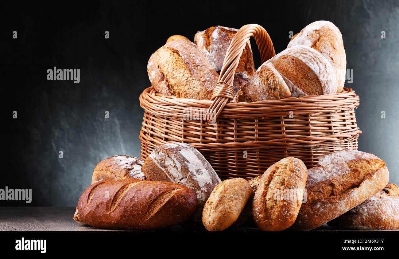 Wicker basket with assorted bakery products Stock Photo